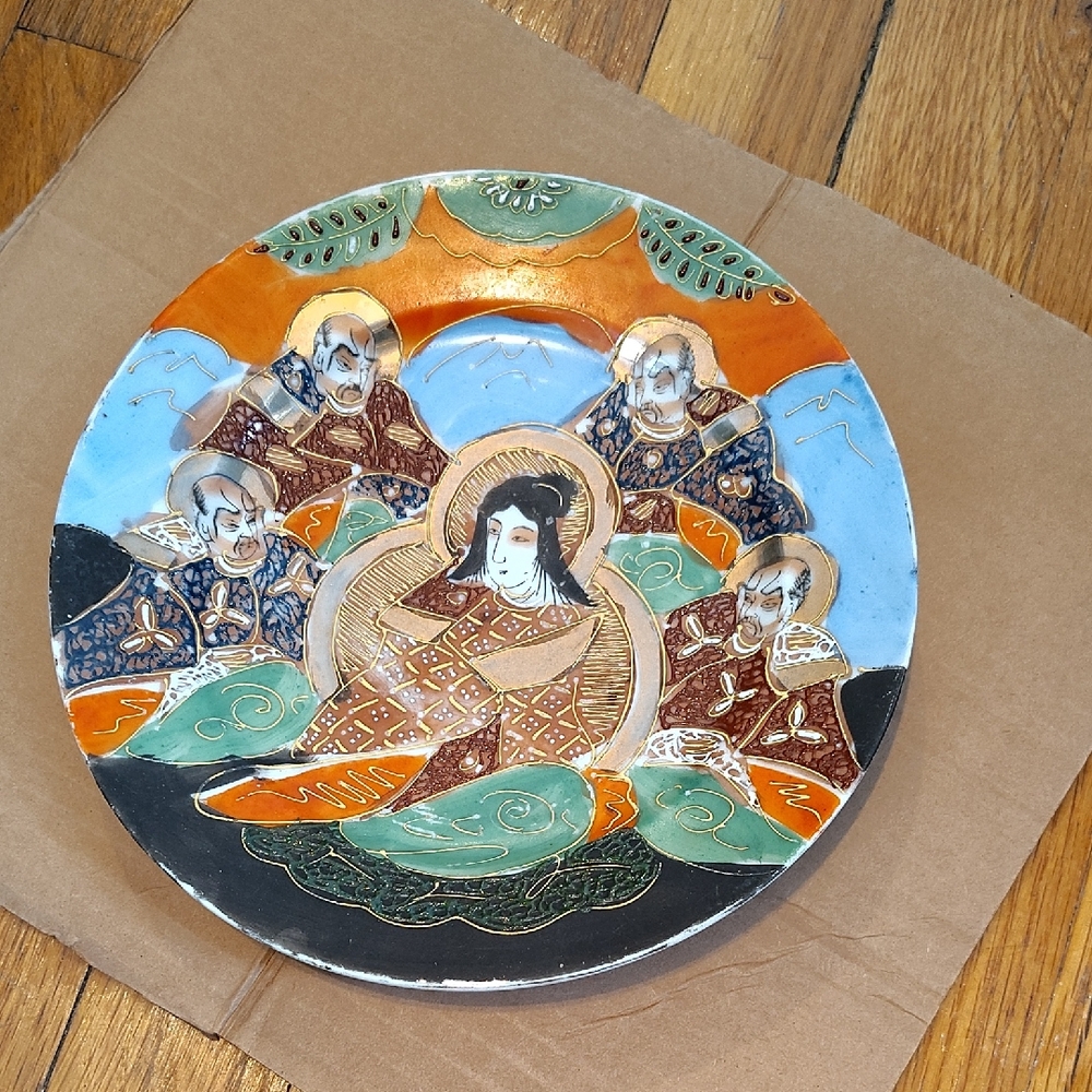 Artistic Ceramic Plate with Orange and Blue Accents